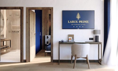 Luksusowy salon z aneksem kuchennym i miejscem do pracy w apartamencie Larix Prime Świeradów-Zdrój